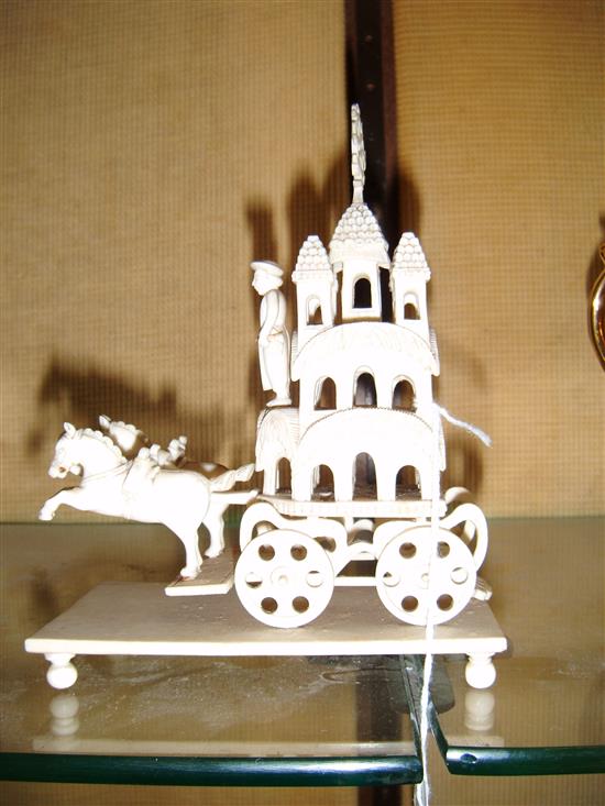 Indian carved ivory horse-drawn ornate carriage, on plinth base